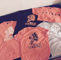 four t - shirts with the word democrat on them